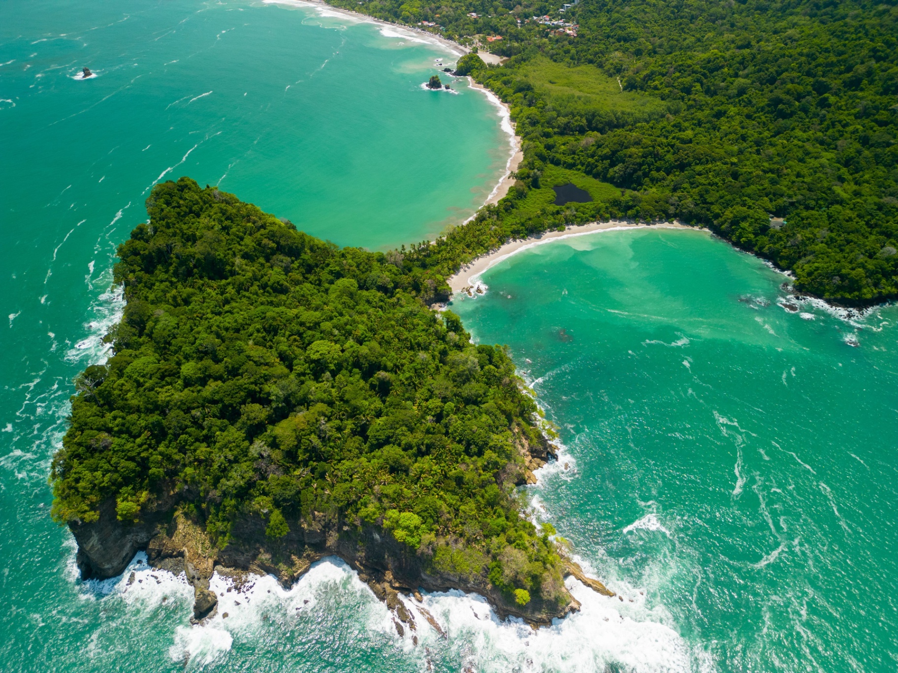 Aerial view of the Manuel Antonio tombolo and twin beaches